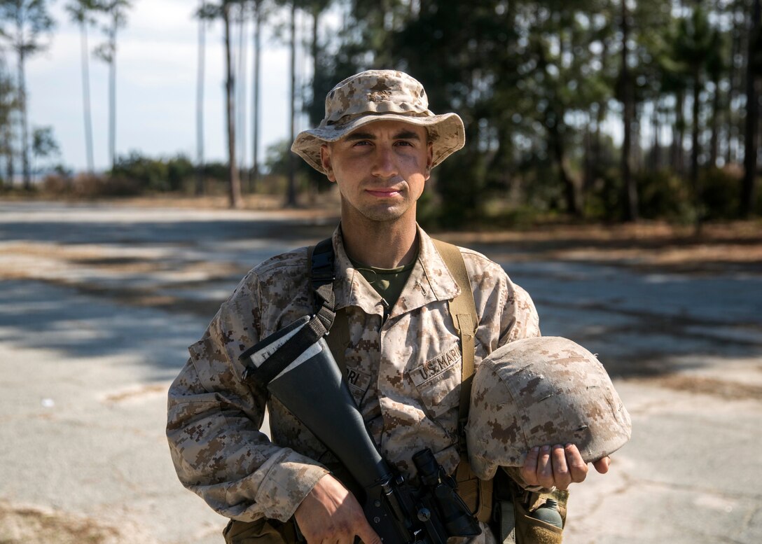 Michael Campofiori, a recruit with Platoon 2020, Company E, 2nd Recruit Training Battalion, Recruit Training Regiment, poses for a photo before participating in the Day Movement Course as part of Basic Warrior Training at Marine Corps Recruit Depot Parris Island, South Carolina, Feb. 6, 2019. Campofiori, a native of Brick Township, New Jersey, overcame Leukemia and is now pursuing a career in the Marine Corps. BWT is a week-long training event that helps teach recruits the basic of combat survival and advanced rifle maneuvers. (U.S. Marine Corps photo by Lance Cpl. Jack A. E. Rigsby)