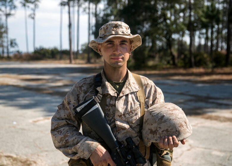 Michael Campofiori, a recruit with Platoon 2020, Company E, 2nd Recruit Training Battalion, Recruit Training Regiment, poses for a photo before participating in the Day Movement Course as part of Basic Warrior Training at Marine Corps Recruit Depot Parris Island, South Carolina, Feb. 6, 2019. Campofiori, a native of Brick Township, New Jersey, overcame Leukemia and is now pursuing a career in the Marine Corps. BWT is a week-long training event that helps teach recruits the basic of combat survival and advanced rifle maneuvers. (U.S. Marine Corps photo by Lance Cpl. Jack A. E. Rigsby)