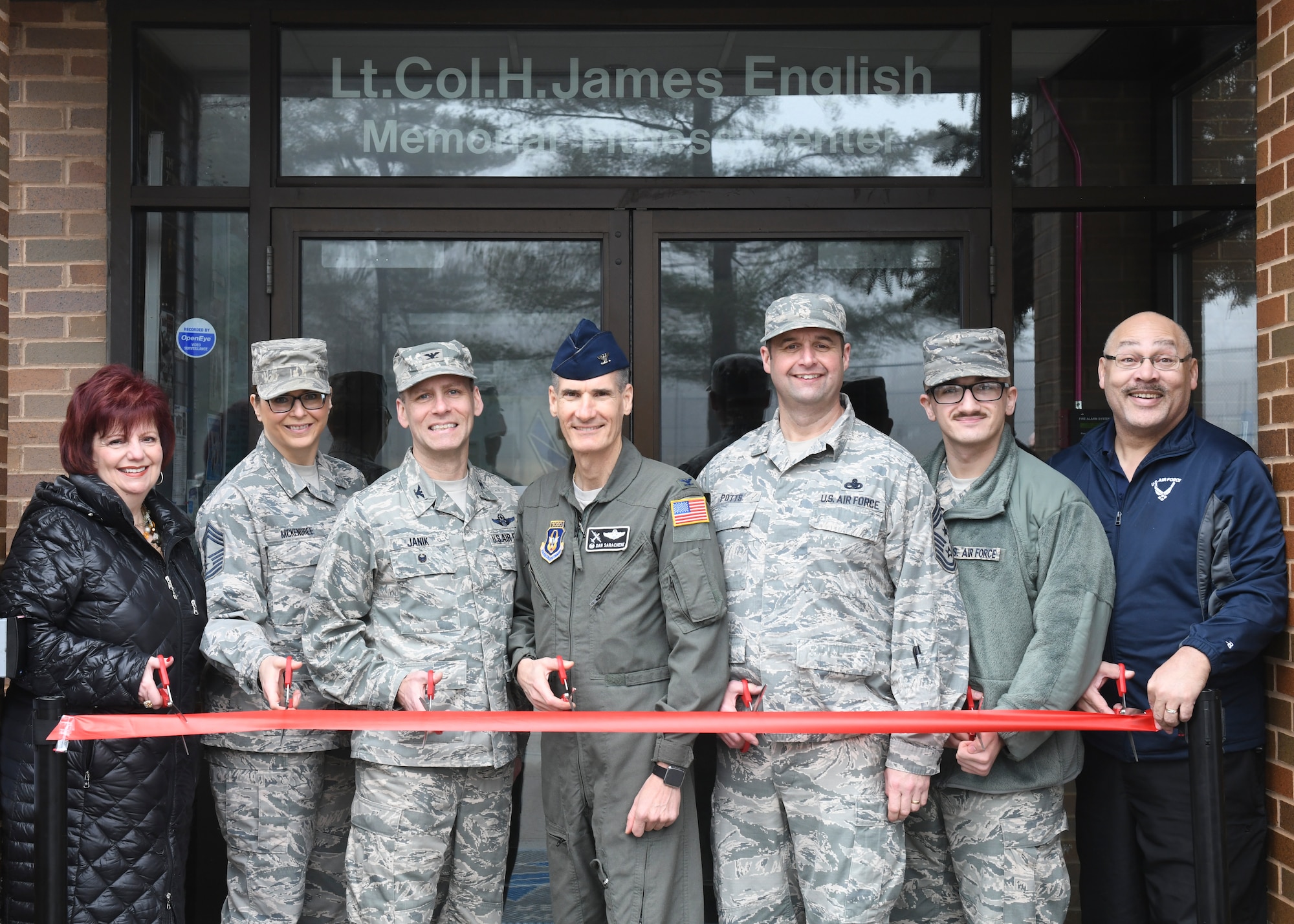 The 910th Airlift Wing's leadership and fitness center representatives cut a ribbon marking the fitness center's new 24-hour access feature, at Youngstown Air Reserve Station, Feb. 7, 2019. The feature was added to be current with other Air Force bases.