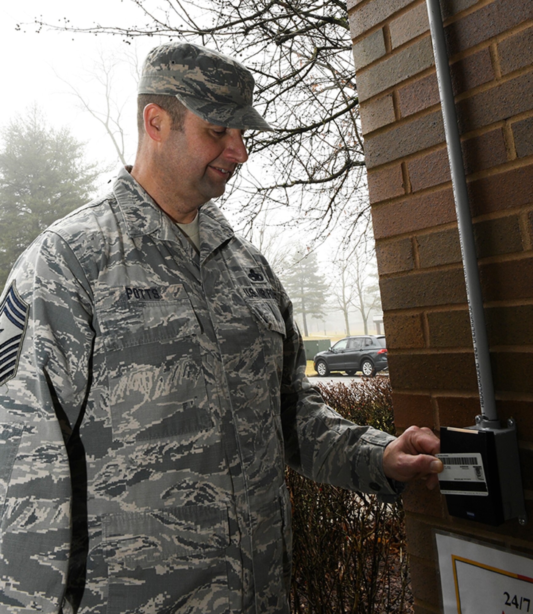 Chief Master Sgt. Bob Potts, 910th Airlift Wing command chief, demonstrates how to access the new 24-hour fitness center, at Youngstown Air Reserve Station, Feb. 7, 2019. The feature was added to be current with other Air Force bases.