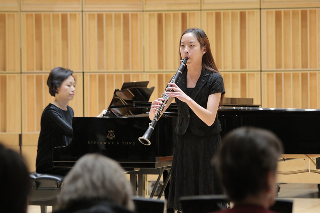 Five high school students from around the nation were selected for the final round of the Marine Band Concerto Competition, presented as a recital open to the public. Pictured is clarinet player Krystal Wu. The winner, euphonium player Peyton Sills, received a $2,500 scholarship, presented by Maj. Gen. James Kessler (USMC, ret.), CEO of the Marine Corps Heritage Foundation. He will perform his solo with the Marine Band in concert on March 31. Runner up, flute player Israel Perez, won a $500 scholarship. (U.S. Marine Corps photo by Master Sgt. Kristin duBois/released.)