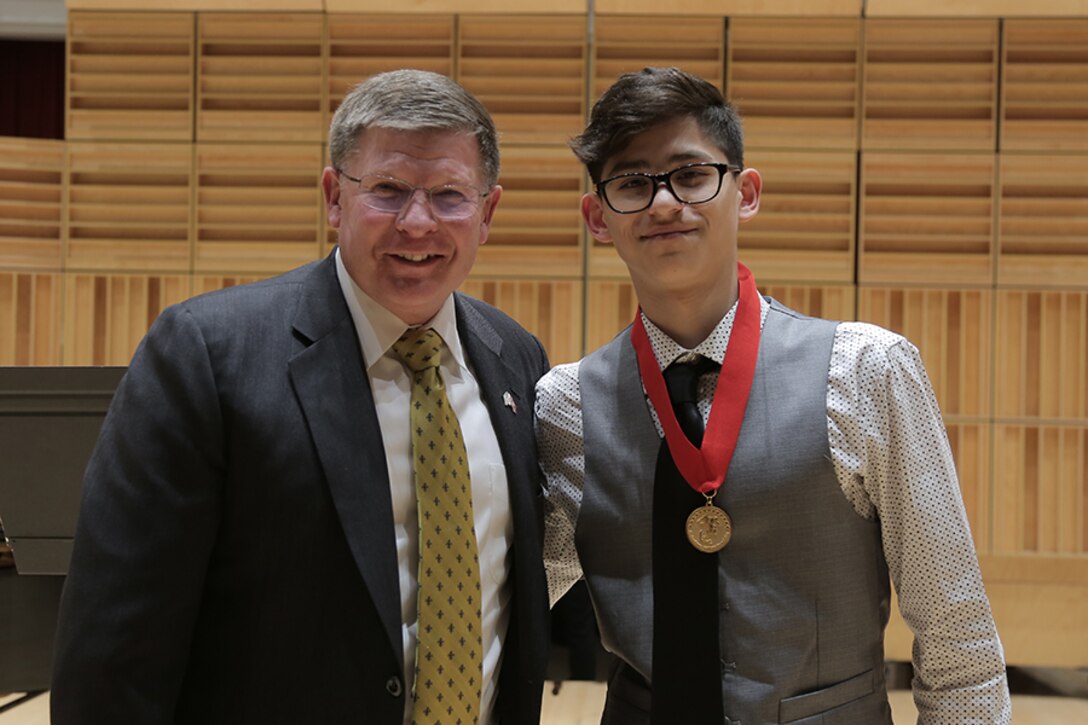 Five high school students from around the nation were selected for the final round of the Marine Band Concerto Competition, presented as a recital open to the public. Runner up flute player Israel Perez won a $500 scholarship presented by Maj. Gen. James Kessler (USMC, ret.), CEO of the Marine Corps Heritage Foundation. (U.S. Marine Corps photo by Master Sgt. Kristin duBois/released.)