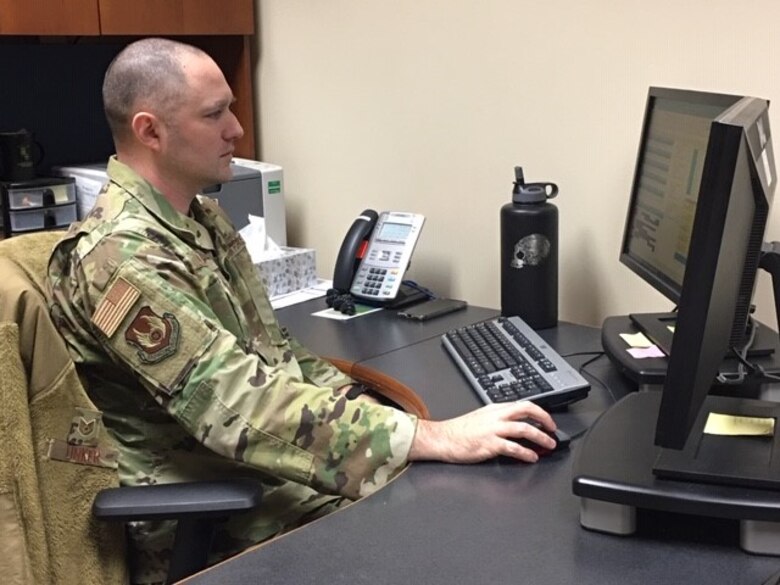 Tech. Sgt. Gregory Linker, Military Personnel Flight section chief, Career Development, observes permanent change of station processing practices, percentages and customer service data to make processes lean and timely.