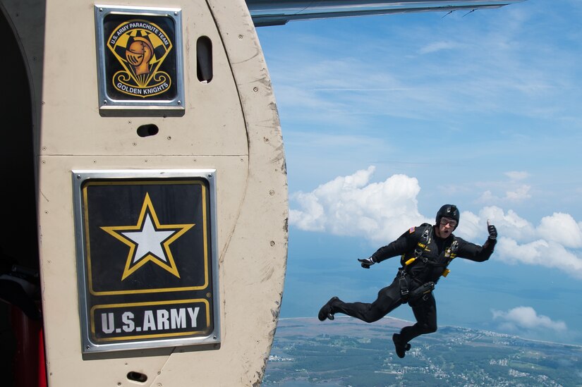 A U.S. Army Golden Knights gold demonstration team member jumps out of an aircraft during AirPower Over Hampton Roads JBLE Air and Space Expo at Joint Base Langley-Eustis, Virginia, May 20, 2018.