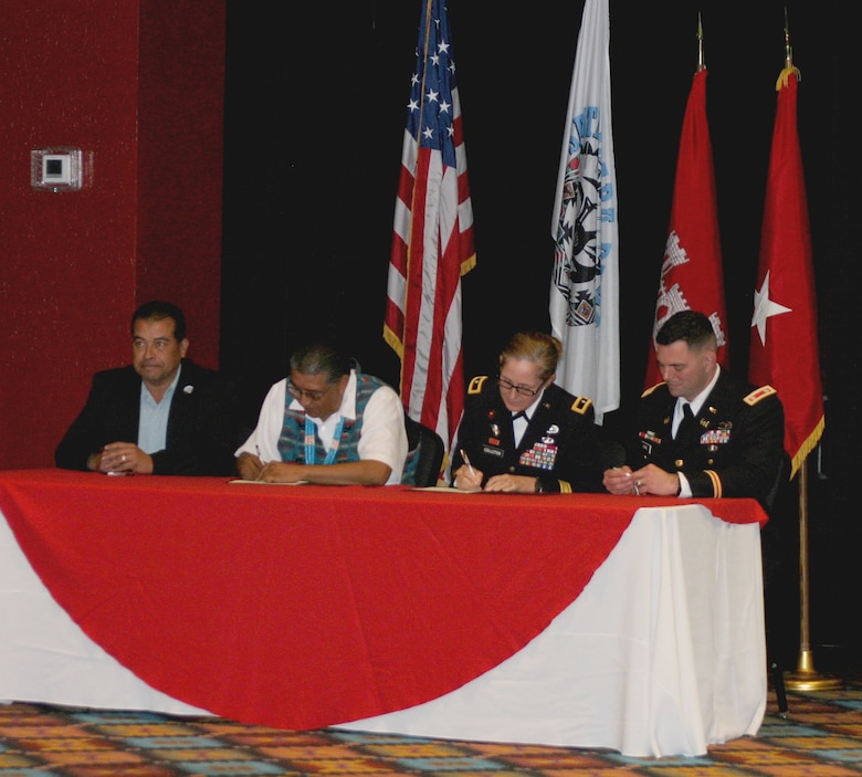 During a Santa Clara Pueblo partnership meeting, (l-r): Santa Clara Lt. Gov. James Naranjo; Santa Clara Gov. J. Michael Chavarria; USACE South Pacific Division commander Brig. Gen. Kimberly Colloton; and USACE Albuquerque District commander Lt. Col. Larry Caswell sign the Watershed Management Plan Proclamation, Nov. 30, 2018, at the Santa Claran Hotel Event Center.