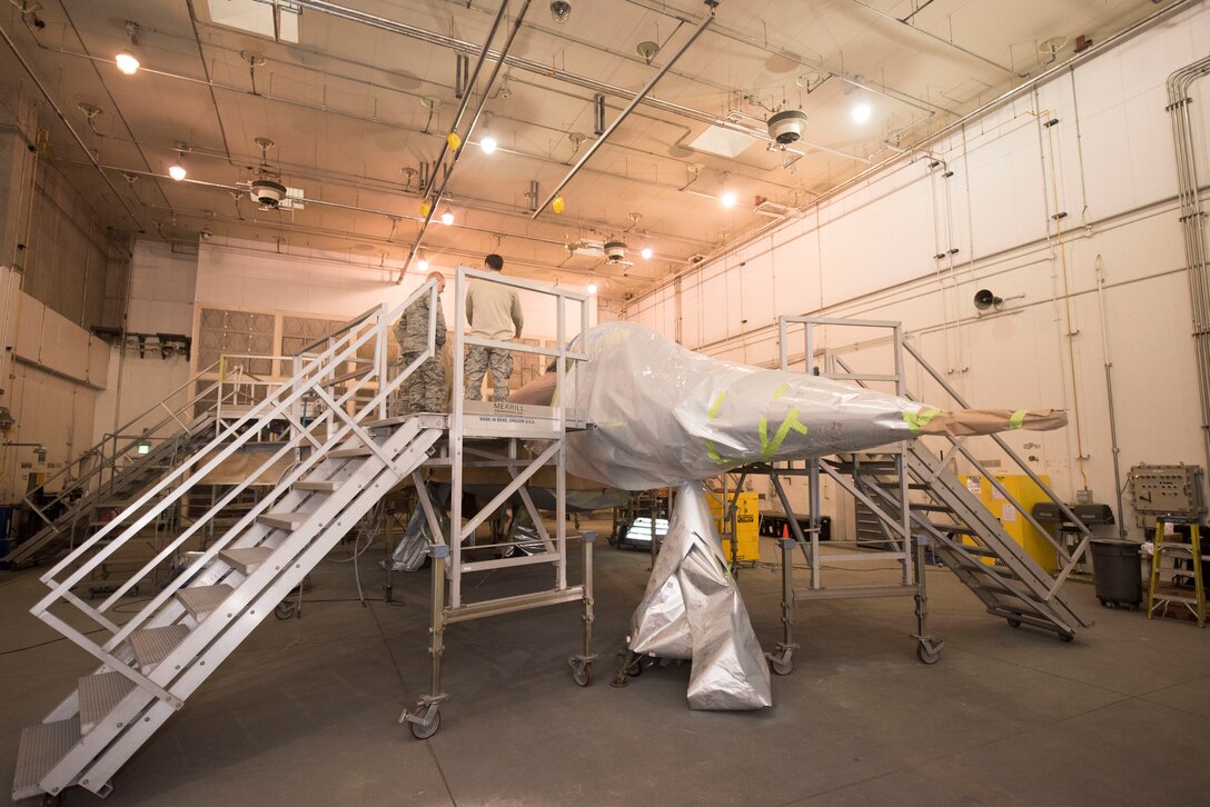 A U.S. Air Force F-16 Fighting Falcon is remodeled by the 35th Maintenance Squadron at Misawa Air Base, Japan, Jan. 29, 2019. The aircraft forewent a repainting to extend its service life and maintain combat air-power.  (U.S. Air Force photo by 1st Lt. Jeremy Garcia)