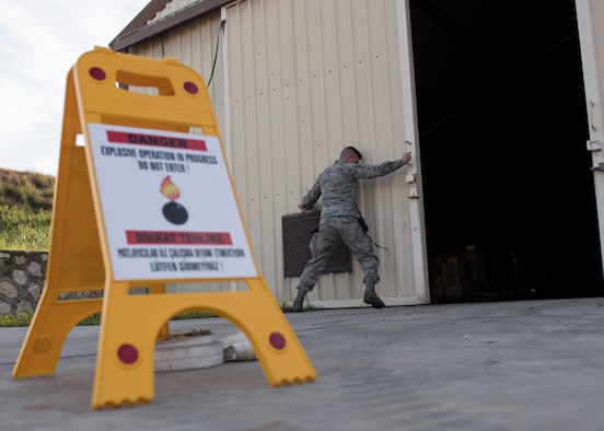 U.S. Air Force Staff Sgt. Matthew Olson, 39th Maintenance Squadron stockpile management production supervisor, closes the door to a munitions storage unit Jan. 31, 2019, at Incirlik Air Base, Turkey.