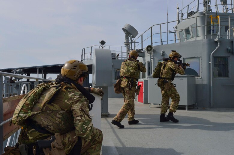 GULF OF THAILAND (Feb. 18, 2019) - Royal Marine commandos and Royal Navy sailors attached to the Duke-class frigate HMS Montrose (F 236) conduct a visit, board, search and seizure drill aboard the Henry J. Kaiser-class fleet replenishment oiler USNS Guadalupe (T-AO 200).