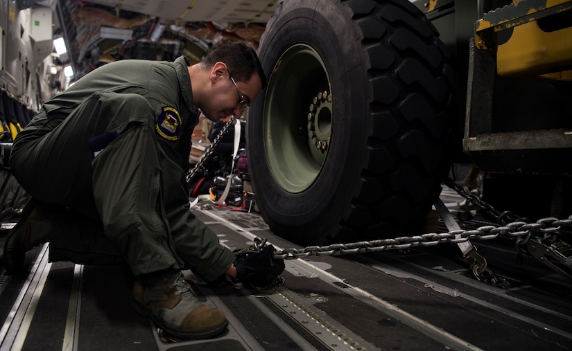 Staff Sgt. Travis Perry, a C-17 Globemaster III loadmaster with the 6th Airlift Squadron, prepares cargo while supporting a humanitarian mission Cucuta, Colombia, Feb. 16. This mission was planned at the request of the U.S. Secretary of State, in close coordination with USAID and with the approval of the government of Colombia. The role of the U.S. military during this peaceful mission is to transport urgently needed aid to Colombia for eventual distribution by relief organizations on the ground for Venezuelans impacted by the rapidly deteriorating crisis in their country. This humanitarian mission underscores the United States’ firm commitment and readiness to respond to the man-made political, economic, and humanitarian crisis in Venezuela. (U.S. Air Force Photo by Tech. Sgt. Gregory Brook)
