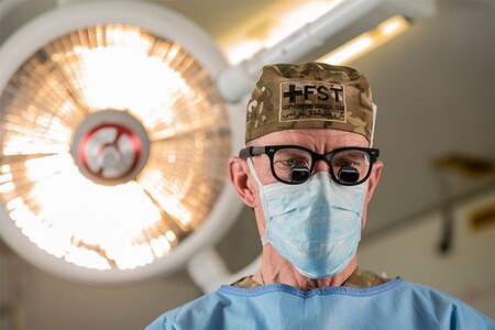 Col. Jay Johannigman, a U.S. Army Reserve general surgeon, poses for a portrait while wearing a pair of binocular loupes during a promotional photo shoot for Army Reserve marketing and recruiting in a field hospital at Fort Hunter Liggett, California, July 18, 2018.