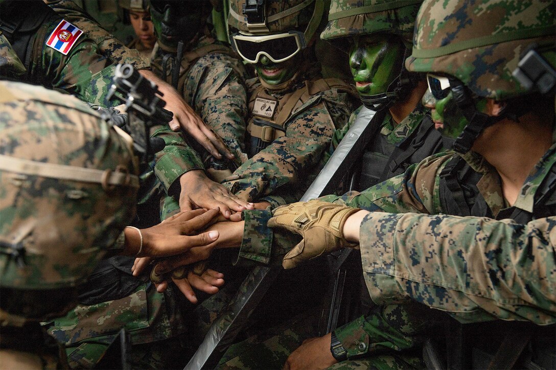 U.S. and Thai marines group together before an exercise.