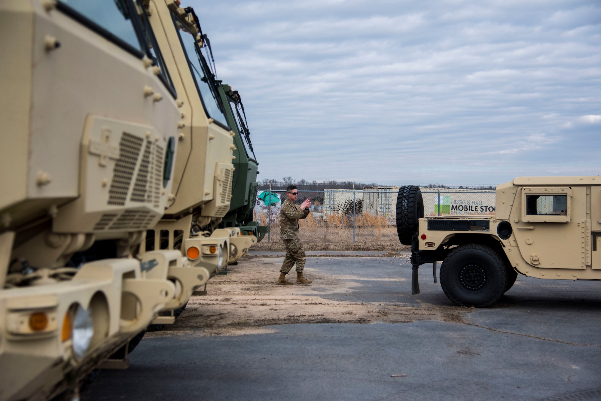 Staff Sgt. Scott Gordon, 34th Combat Training Squadron, marshals in a Humvee into the vehicle storage yard.