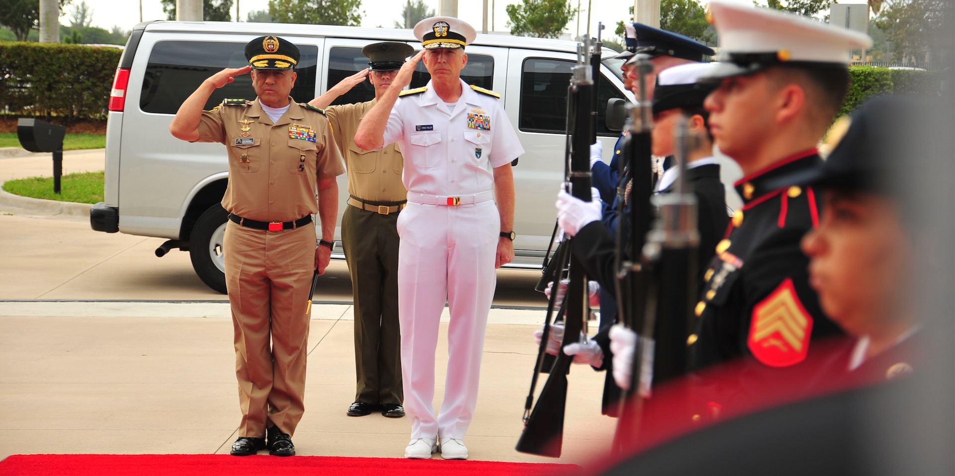 U.S. Navy Adm. Craig Faller, commander of U.S. Southern Command, and Colombian Army Maj. Gen. Luis Navarro Jiménez, Commanding General of the Colombian Military Forces, render honors at SOUTHCOM headquarters.