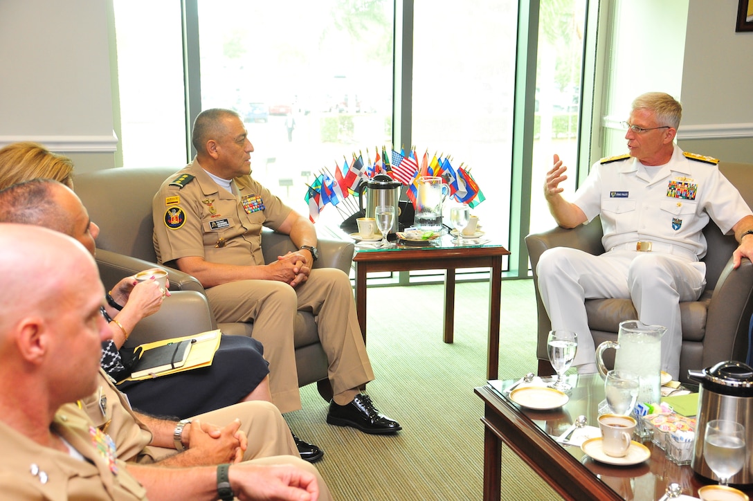 U.S. Navy Adm. Craig Faller, commander of U.S. Southern Command, and Colombian Army Maj. Gen. Luis Navarro Jiménez, Commanding General of the Colombian Military Forces, talk at SOUTHCOM headquarters.