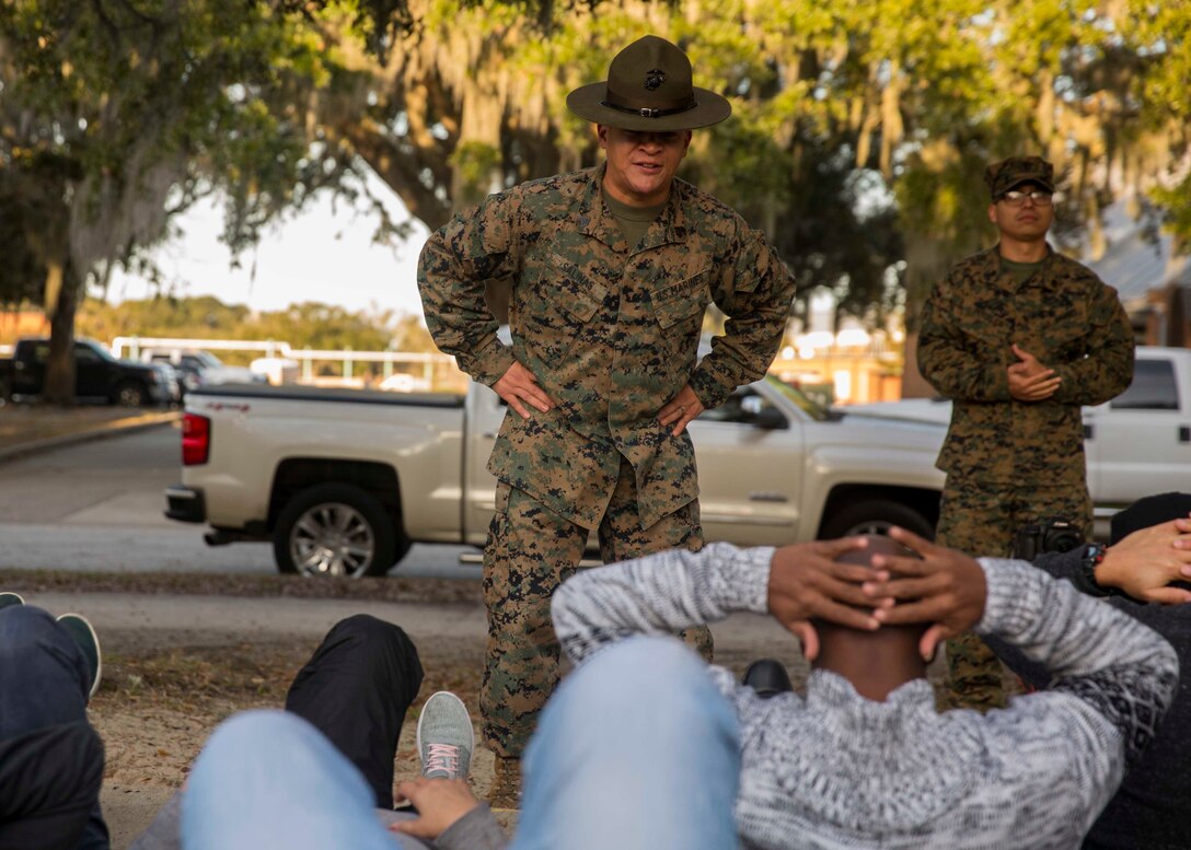 U.S. Marine Corps Sgt. Roberto Salinas, a drill instructor with Company M, 3rd Recruit Training Battalion, Recruit Training Regiment, instructs attendees of the Educators Workshop aboard Marine Corps Recruit Depot Parris Island, South Carolina, Jan. 30, 2019. These educators traveled from Recruiting Station Fort Lauderdale to experience the Educators Workshop. The workshop allows educators to have an inside look at educational benefits and career opportunities in the Marine Corps. (U.S. Marine Corps photo by Lance Cpl. Jack A. E. Rigsby)