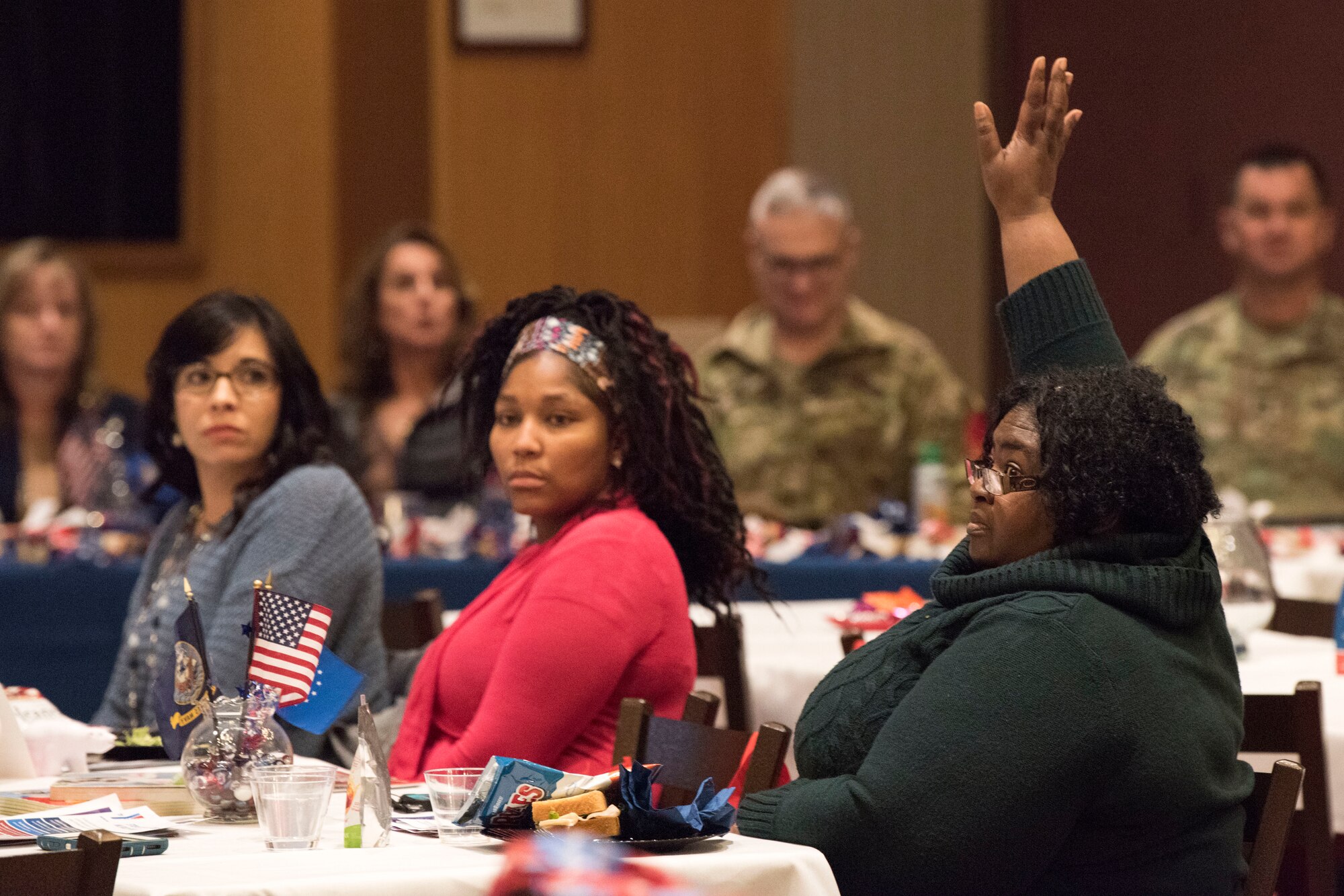 Attendees ask questions during a military spouse town hall and luncheon at Joint Base Elmendorf-Richardson, Alaska, Feb. 12, 2019. The Military and Family Readiness Center-hosted event had more than 120 attendees with the theme “Taking Care of People.”
