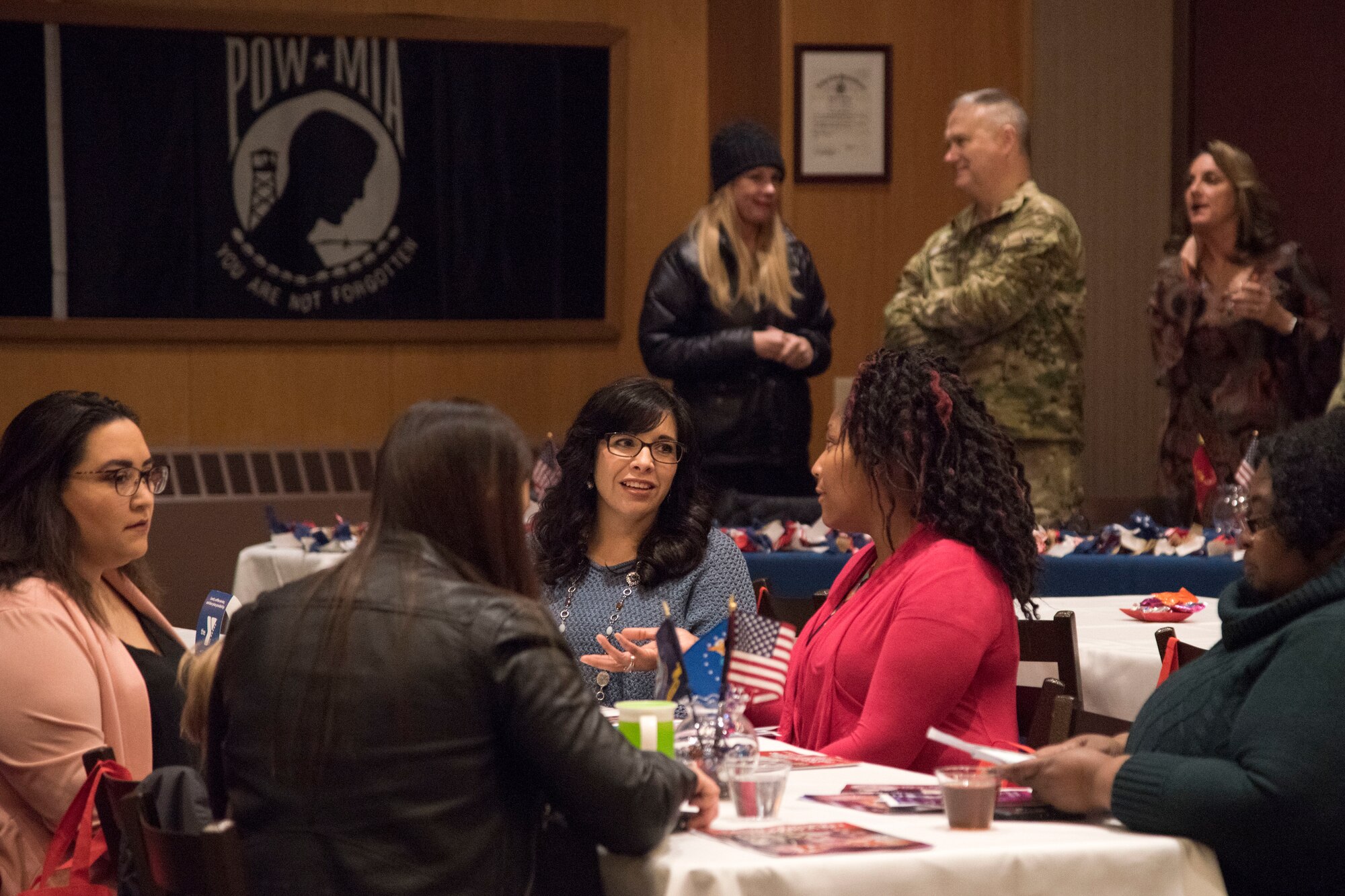 Attendees talk to one another during a military spouse town hall and luncheon at Joint Base Elmendorf-Richardson, Alaska, Feb. 12, 2019. The Military and Family Readiness Center-hosted event had more than 120 attendees with the theme “Taking Care of People.”