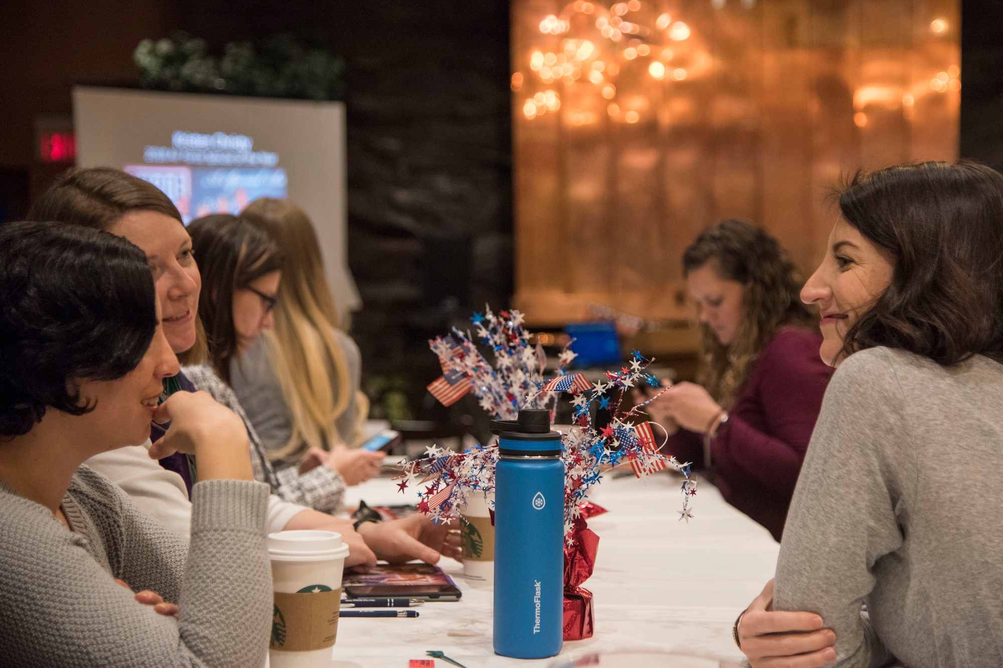 Attendees sign in during a military spouse town hall and luncheon at Joint Base Elmendorf-Richardson, Alaska, Feb. 12, 2019. The Military and Family Readiness Center-hosted event had more than 120 attendees with the theme “Taking Care of People.”