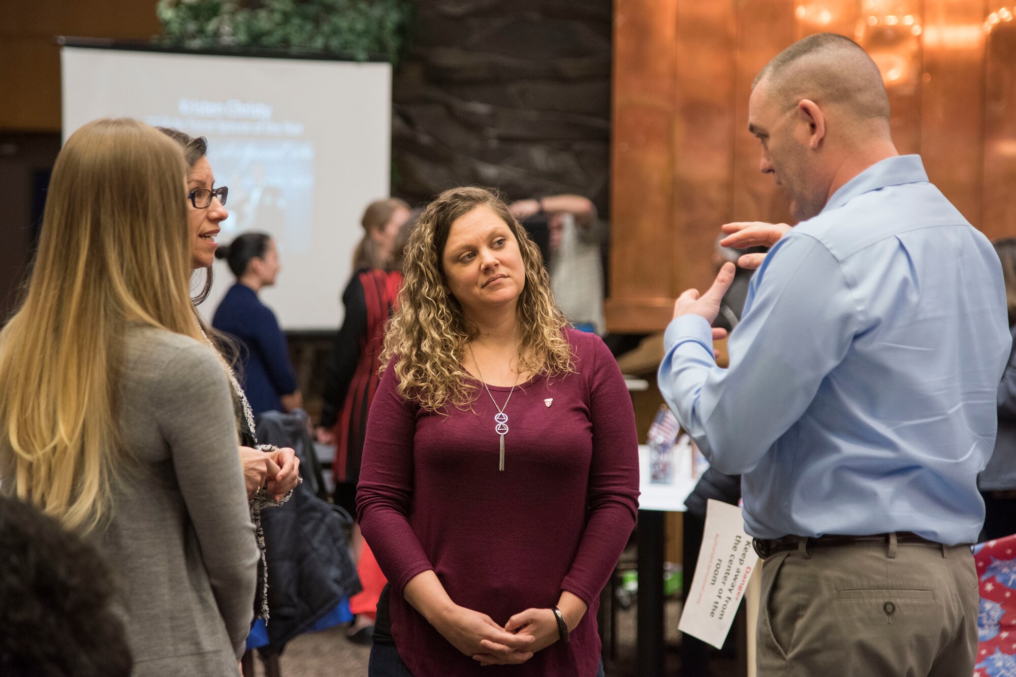 Attendees talk to one another during a military spouse town hall and luncheon at Joint Base Elmendorf-Richardson, Alaska, Feb. 12, 2019. The Military and Family Readiness Center-hosted event had more than 120 attendees with the theme “Taking Care of People.”