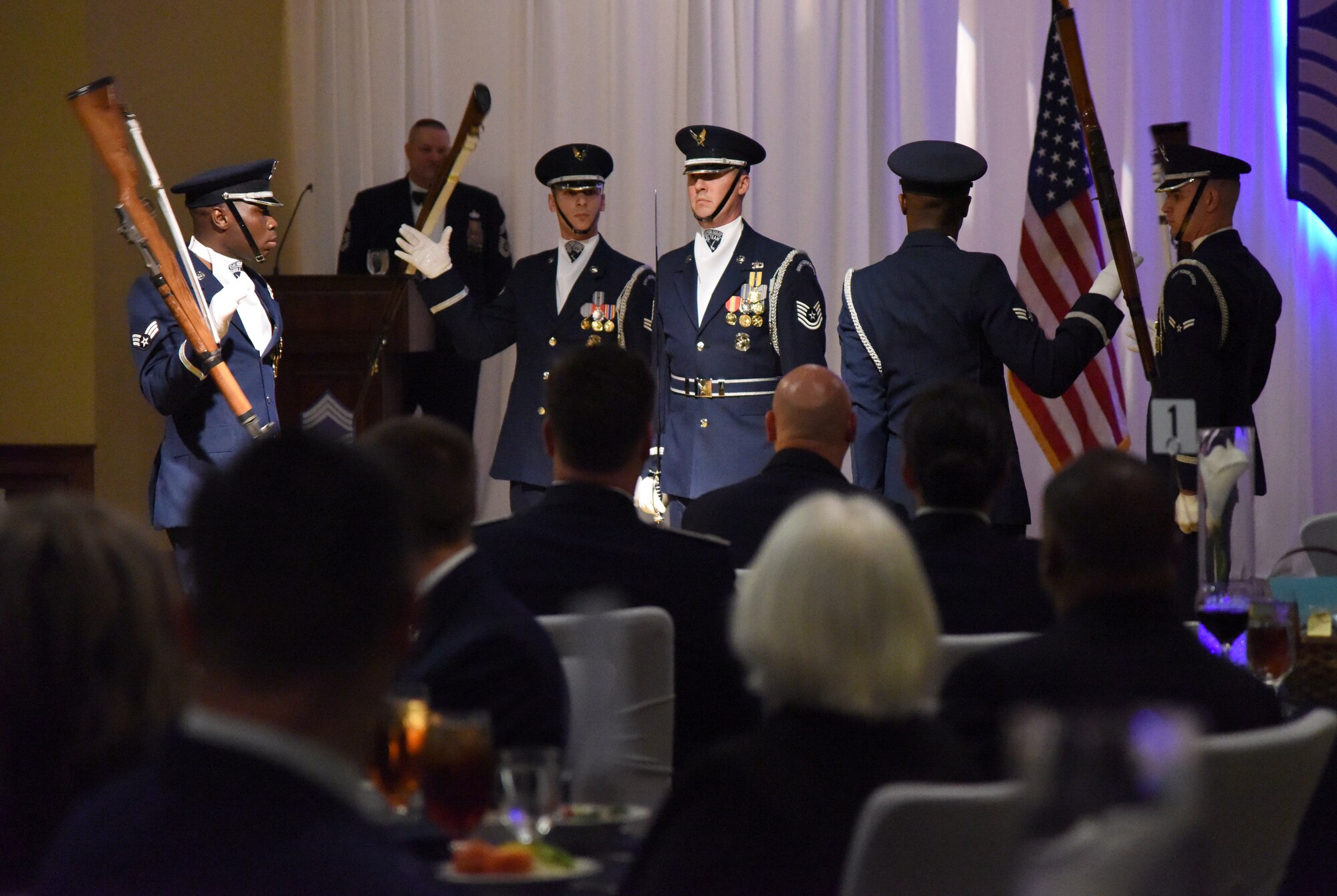 Members of the U.S. Air Force Honor Guard Drill Team perform during the Chief Induction Ceremony inside the Bay Breeze Event Center at Keesler Air Force Base, Mississippi, Feb. 15, 2019. Five Keesler Airmen earned their chief master sergeant stripe during the 2019 promotion release. Air Force officials selected 479 senior master sergeants for promotion to chief master sergeant out of 2,241 eligible for a selection rate of 21.37 percent. Chief master sergeants make up one percent of the Air Force enlisted force. (U.S. Air Force photo by Kemberly Groue)