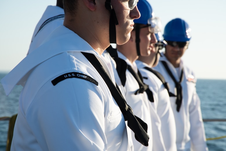 Sailors stand by during a sea-and-anchor detail aboard the Avenger-class mine countermeasures ship USS Chief (MCM 14) as the ship transits to Muara Naval Base.