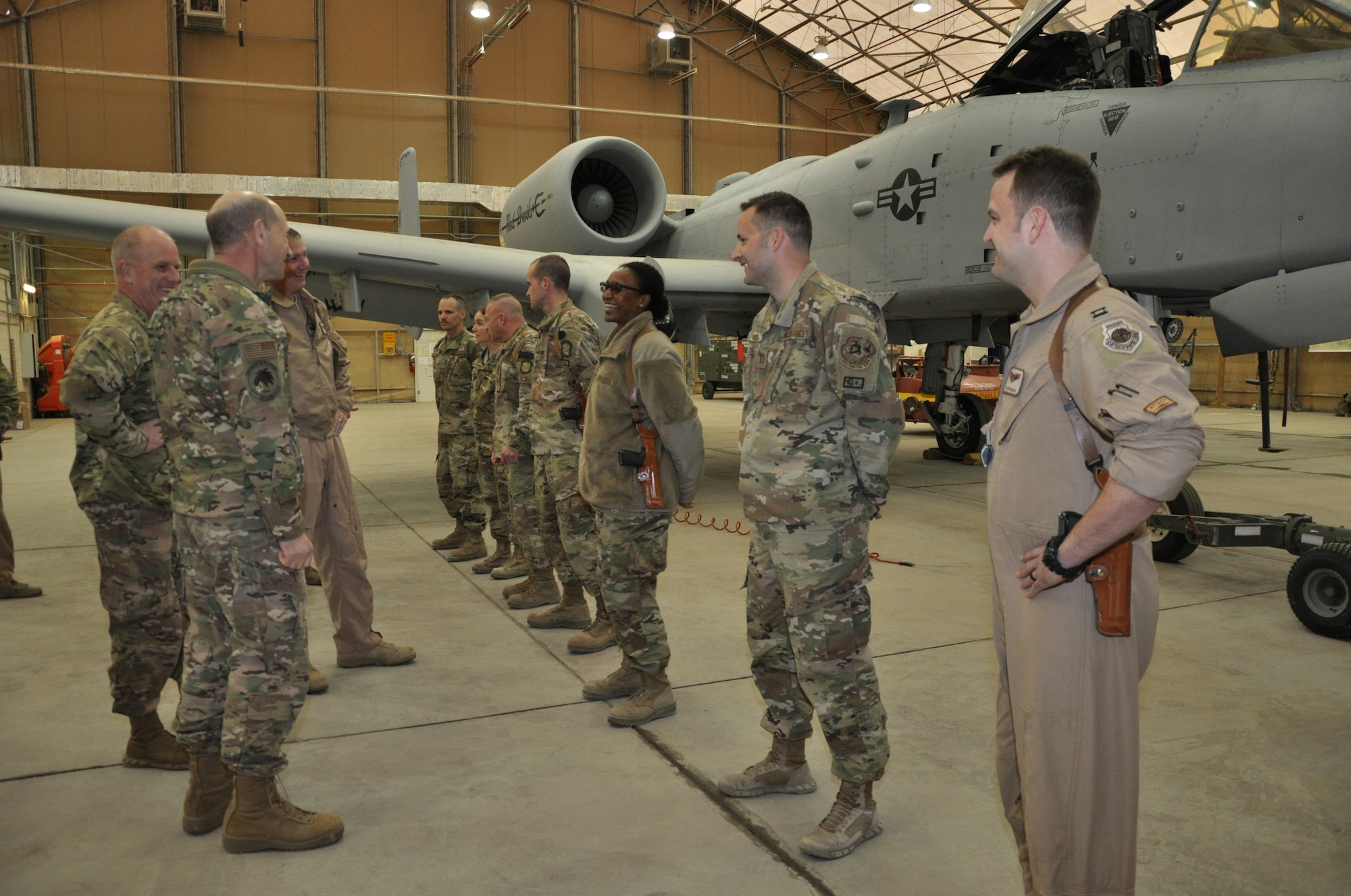 Gen. Mike Holmes, commander of Air Combat Command, and Chief Master Sgt. Frank H. Batten III, ACC command chief master sergeant, meet Airmen from the 75th Expeditionary Fighter Squadron at Kandahar Airfield, Afghanistan, Feb. 13, 2019.