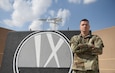 U.S. Army Sgt. 1st Class Timothy Hartranft, 9th Expeditionary Bomb Squadron ground liaison officer, stands in front of the 9th EBS T-Wall at Al Udeid Air Base, Qatar, Feb. 6, 2019. The GLO translates the ground units’ intent into action in the air, also known as green to blue. His job is to translate green to blue and blue to green between ground commanders and the combined forces air component commander; integrating and synchronizing air and ground operations in the U.S. Central Command area of responsibility. (U.S. Air Force photo by Senior Airman Travis Beihl)