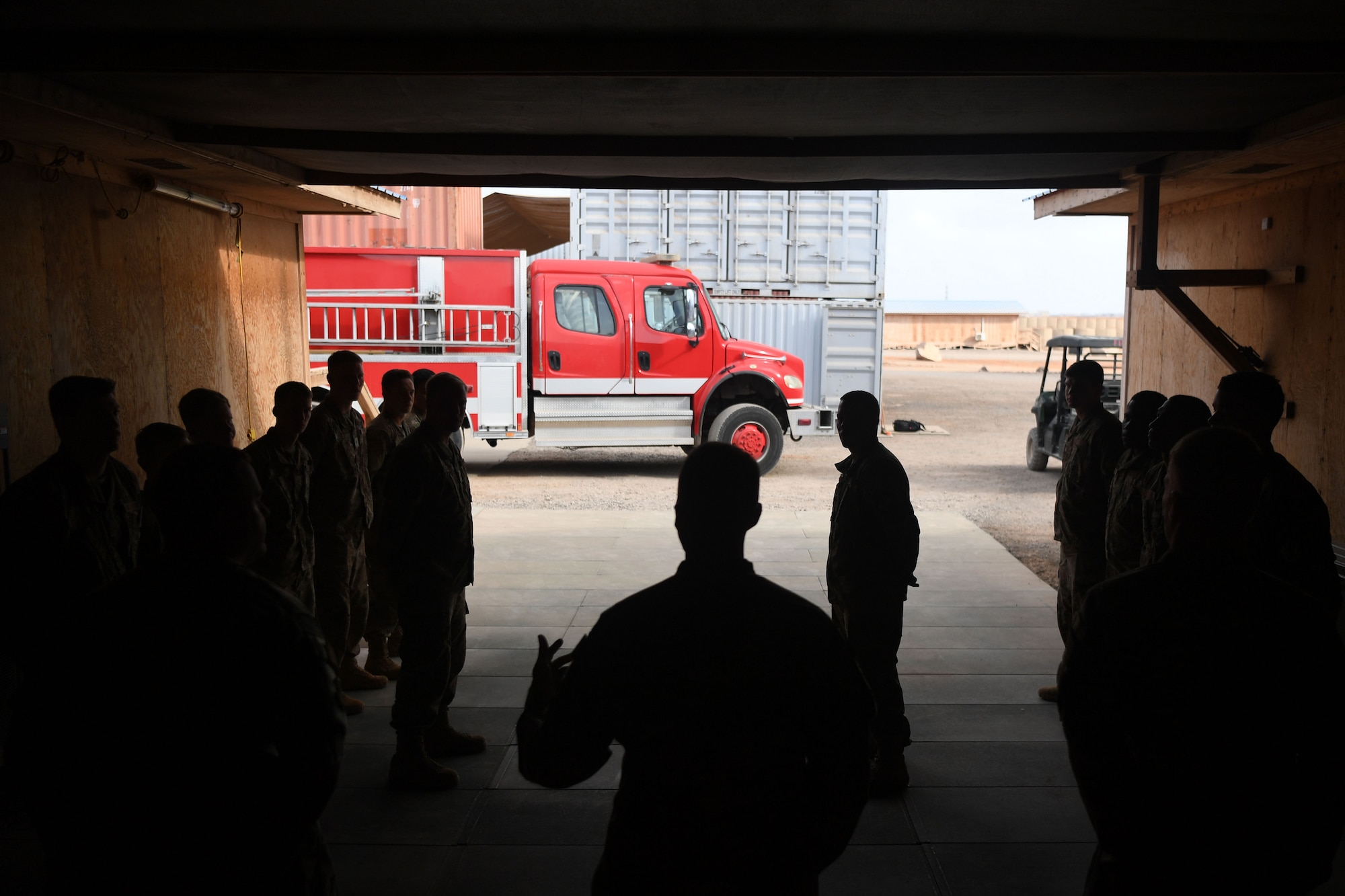 The 870th Air Expeditionary Squadron fire department and military community took part in a decades-old tradition and pushed a fire truck into its new home during a ceremony here Feb. 8.