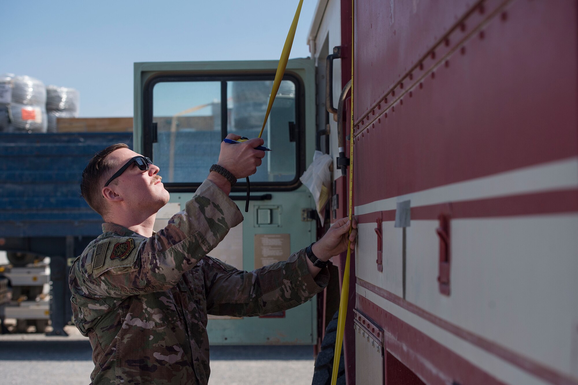 Staff Sgt. Corey Klucker, 8th Expeditionary Air Mobility Squadron (EAMS) load planner, inspects a fire truck to prior to aerial transport Feb. 20, 2019, at Al Udeid Air Base, Qatar. 8th EAMS Airmen ensure aircraft can rapidly and safely deliver vital equipment and passengers to locations across U.S. Central Command’s area of responsibility. The squadron consists of active-duty, Air Force Reserve, and Air National Guard Airmen, who bring a diverse total force perspective to their mission. (U.S. Air Force photo by Tech. Sgt. Christopher Hubenthal)