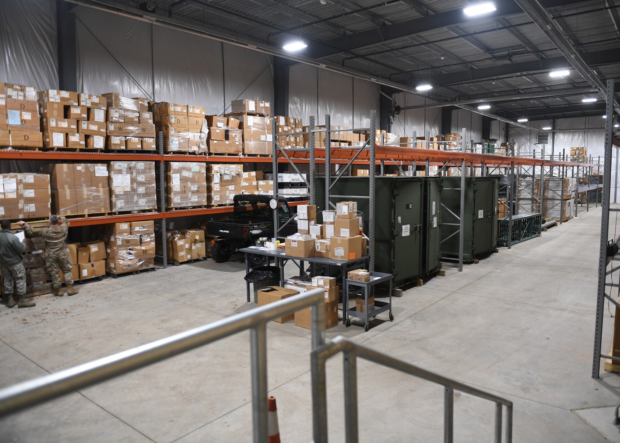 Tech. Sgt. Tobin Civils and Staff Sgt. Mamadou Bah, material management craftsmen with the 911th Logistics Readiness Squadron, take an account of the used space in a newly built warehouse at the Pittsburgh International Airport Air Reserve Station, Pennsylvania, Feb. 14, 2019. The warehouse was built as an addition to Building 312 and was finished in early November 2018. (U.S. Air Force Photo by Senior Airman Grace Thomson)