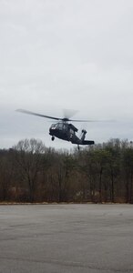 A West Virginia Army National Guard HH-60 Black Hawk assigned to Company C, 2-104th General Support Aviation Battalion (GASB), prepares to land in the parking lot of Ritchie County High School in Ellenboro, W.Va., following an aerial rescue mission of a stranded motorist Feb. 20, 2019.