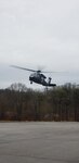 A West Virginia Army National Guard HH-60 Blackhawk assigned to Company C., 2-104th General Support Aviation Battalion (GASB), prepares to land in the parking lot of Ritchie County High School in Ellenboro, W.Va., following a successful aerial rescue mission for a stranded motorist Feb. 20, 2019. The state mission of the 2-104th GASB, located in Williamstown, W.Va., is to provide aeromedical evacuation and search and rescue capability to the Governor and the citizens of West Virginia in times of emergency. (Courtesy photo)
