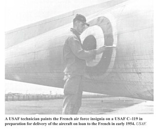 A USAF Airplane is being repainted with French markings.