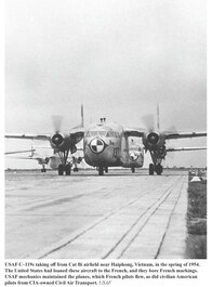 A USAF C-119 plane taking off from a base  in Vietnam, 1954.