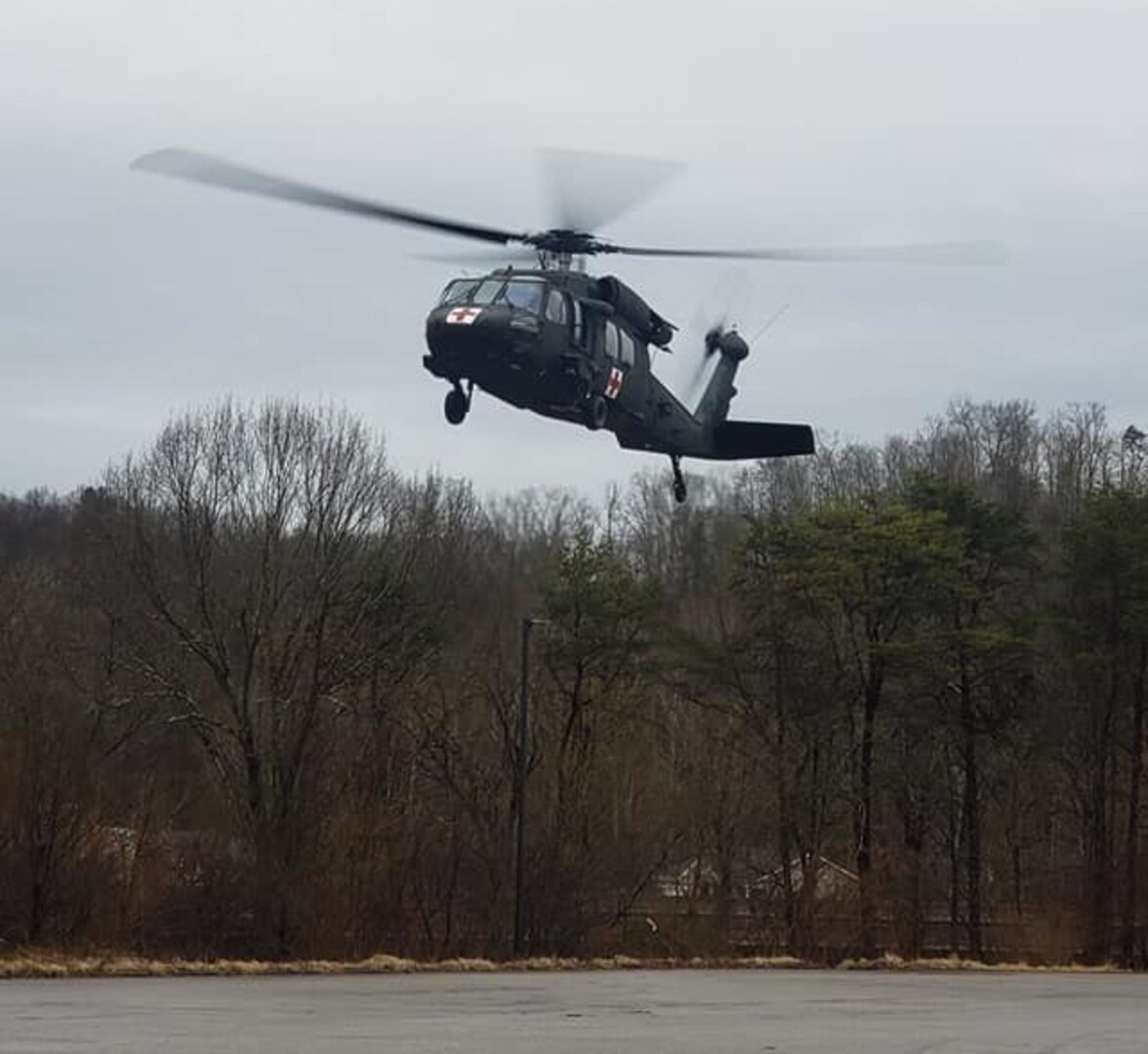 A West Virginia Army National Guard HH-60 Black Hawk assigned to Company C, 2-104th General Support Aviation Battalion (GASB), prepares to land in the parking lot of Ritchie County High School in Ellenboro, W.Va., following an aerial rescue mission of a stranded motorist Feb. 20, 2019.