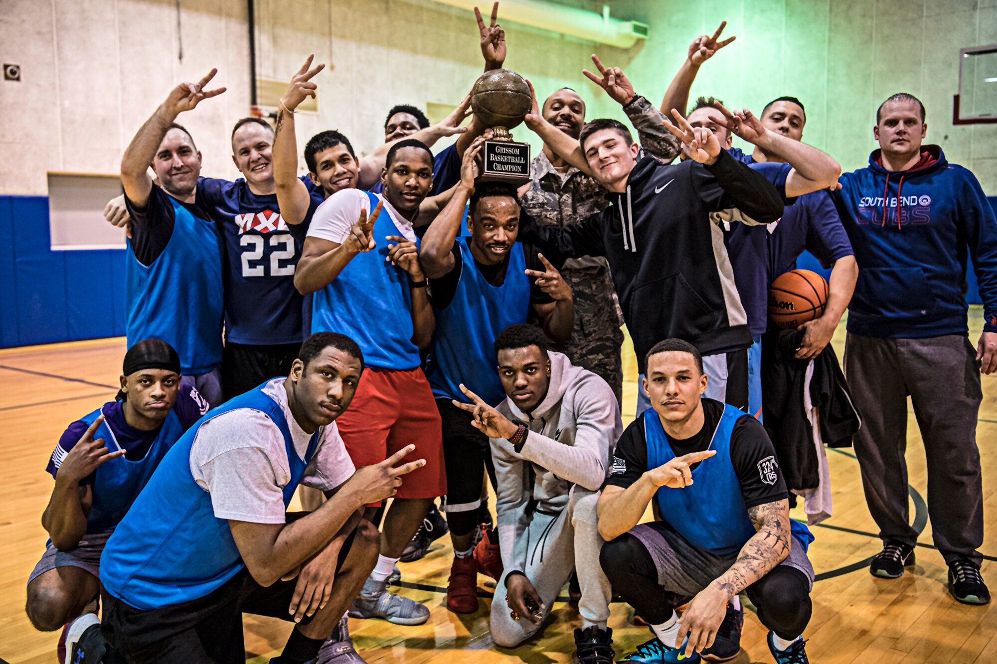 Members of the 434th Maintenance Group pose with the intramural basketball championship trophy following their win Feb. 9, 2019 at Grissom Air Reserve Base, Ind. The Maintainers torqued a tourniquet on the 434th Aerospace Medicine Squadron, winning 52-10 to repeat as the base’s basketball champion. (U.S. Air Force photo/Senior Airman Harrison Withrow)