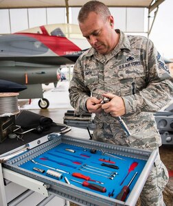 Senior Master Sgt. David Smith, an F-16 Fighting Falcon weapons loader assigned to the 149th Fighter Wing, prepares a jet for weapons training at Joint Base San Antonio-Lackland Feb. 9.