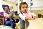 Roxanna Ramos cares for babies at the Defense Logistics Agency’s Fort Belvoir, Virginia, Child Development Center, one of five centers at DLA major subordinate commands.