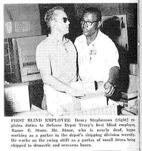 Henry Stephenson (right) explains duties to Rance Stone, Defense Depot Tracy’s first blind employee, who was also nearly deaf, as featured in the Dec. 26, 1969, issue of DSA News.