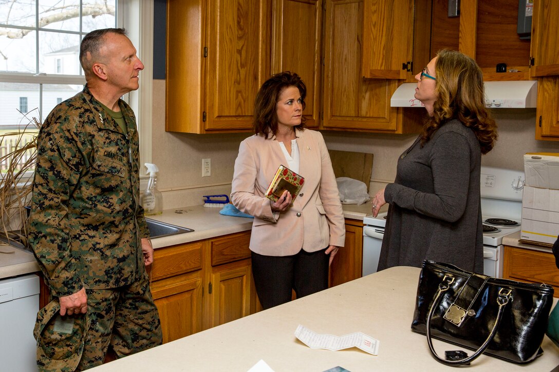 Lt. Gen. Charles G. Chiarotti, left, deputy commandant, Installations and Logistics, and the Honorable Mrs. Phyllis L. Bayer, center, assistant secretary of the Navy for energy, installations and the environment tour privatized military housing with spouses during a visit to Marine Corps Base Camp Lejeune, North Carolina, Feb. 15, 2019. Bayer visited MCB Camp Lejeune residential communities to assess on going restoration efforts on the installation. (U.S. Marine Corps photo by Lance Cpl. Isaiah Gomez)