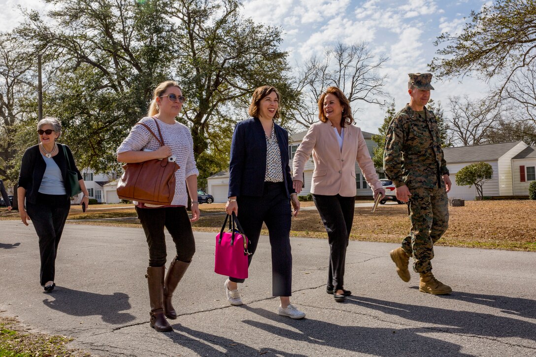 The Honorable Mrs. Phyllis L. Bayer, center, assistant secretary of the Navy for energy, installations and the environment, and Brig. Gen. Benjamin T. Watson, right, commanding general, Marine Corps Installations East-Marine Corps Base Camp Lejeune tour privatized military housing with spouses during a visit to Marine Corps Base Camp Lejeune, North Carolina, Feb. 15, 2019. Bayer visited MCB Camp Lejeune residential communities to assess on going restoration efforts on the installation. (U.S. Marine Corps photo by Lance Cpl. Isaiah Gomez)