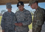 Airman 1st Class Michael Prado, 343rd Training Squadron student, showcases the “Ride Systems” application for Joint Base San Antonio shuttles to Brig. Gen. Laura Lenderman, 502d Air Base Wing and JBSA commander, and Army Private Brandon Cox, 701st Military Police Battalion, at JBSA-Lackland Feb. 20, 2019.  The app includes Global Positioning System tracking capabilities with mapping and coordination with the ground transportation offices to track exactly where each bus is, their route and how long the wait time is.