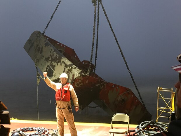A  Galveston District U.S Army Corps of Engineer contractor directs a heavy lift crane. Contract divers recently removed debris from the Bayport Ship Channel. This effort reopened the Bayport Ship Channel early February 2019.