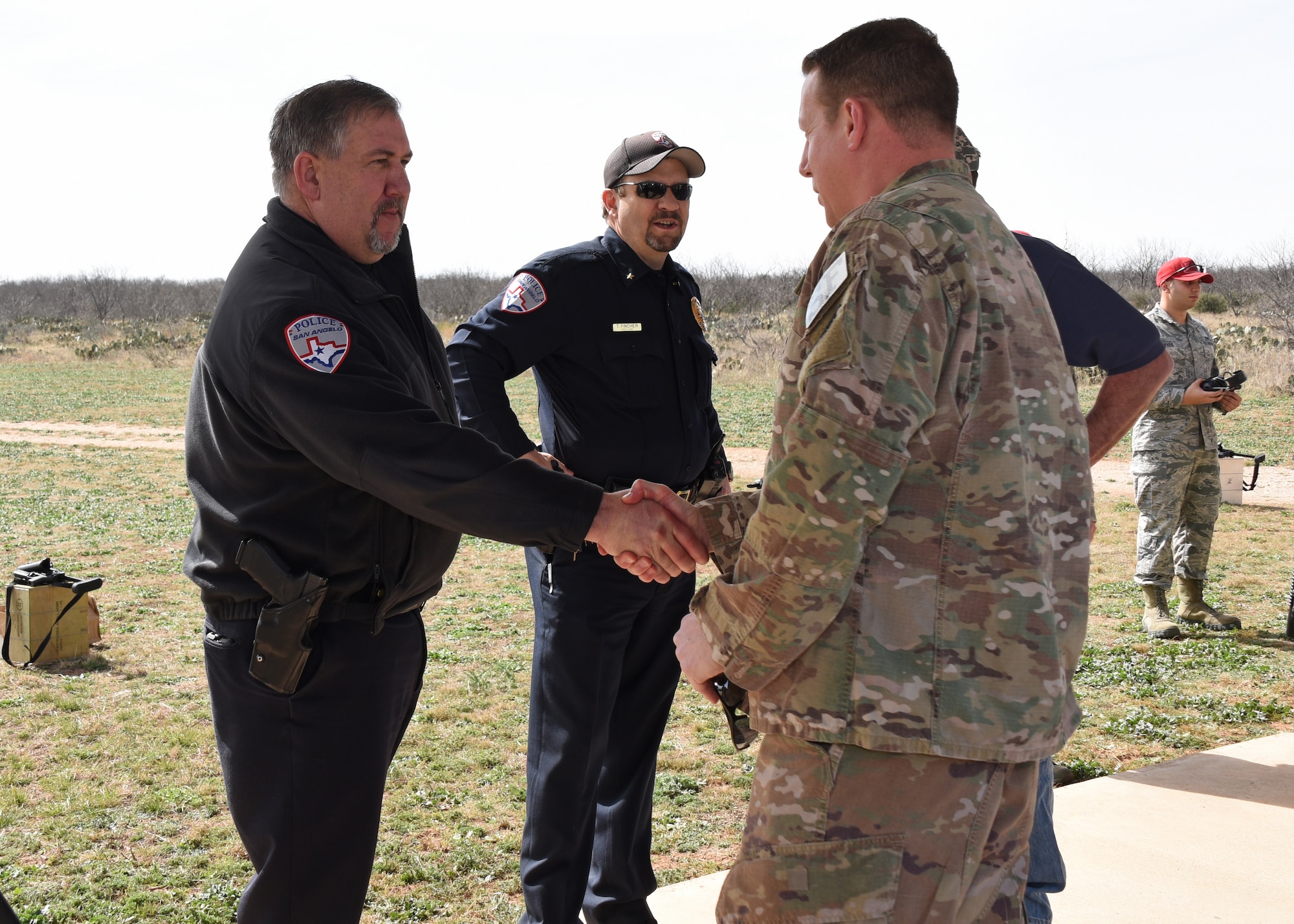 U.S. Air Force Master Sgt. Seth Swaboski, 17th Security Forces Squadron advisor, is greeted by San Angelo Police Depart Chief of Police, Frank Carter and SAPD Assistant Chief, Tracey Fincher at the SAPD firing range, Texas, during a demonstration of Goodfellow’s grenade launchers, Feb. 15, 2019.  One of the many agreements San Angelo and Goodfellow has allows the SAPD and Goodfellow to train on the other’s firing range when needed. (U.S. Air Force photo by Airman 1st Class Zachary Chapman/Released)