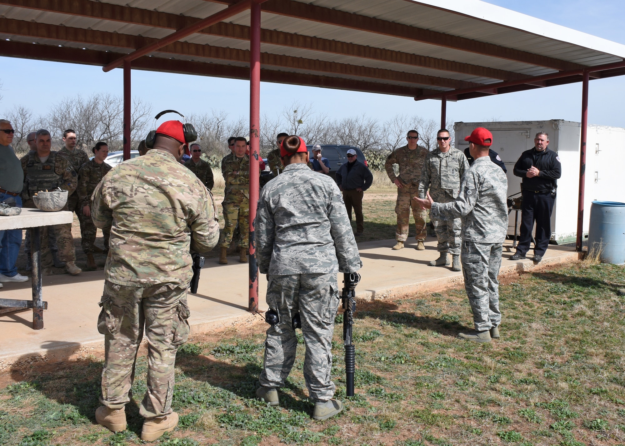 Members of the combat arms team, part of the 17th Security Forces Squadron, give a safety brief before firing the M203 and M320 grenade launchers at the San Angelo Police Department firing range,Texas, Feb. 15, 2019. Goodfellow members had the chance to fire both weapons to see firsthand the difference and improvements in the M320. (U.S. Air Force photo by Airman 1st Class Zachary Chapman/Released)