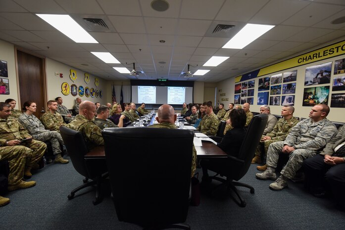 Maj. Gen. Sam C. Barrett, 18th Air Force commander, and Chief Master Sgt. Daniel C. Simpson, 18th Air Force command chief master sergeant, sit in on a base mission brief Feb. 11, 2019, at Joint Base Charleston, S.C.