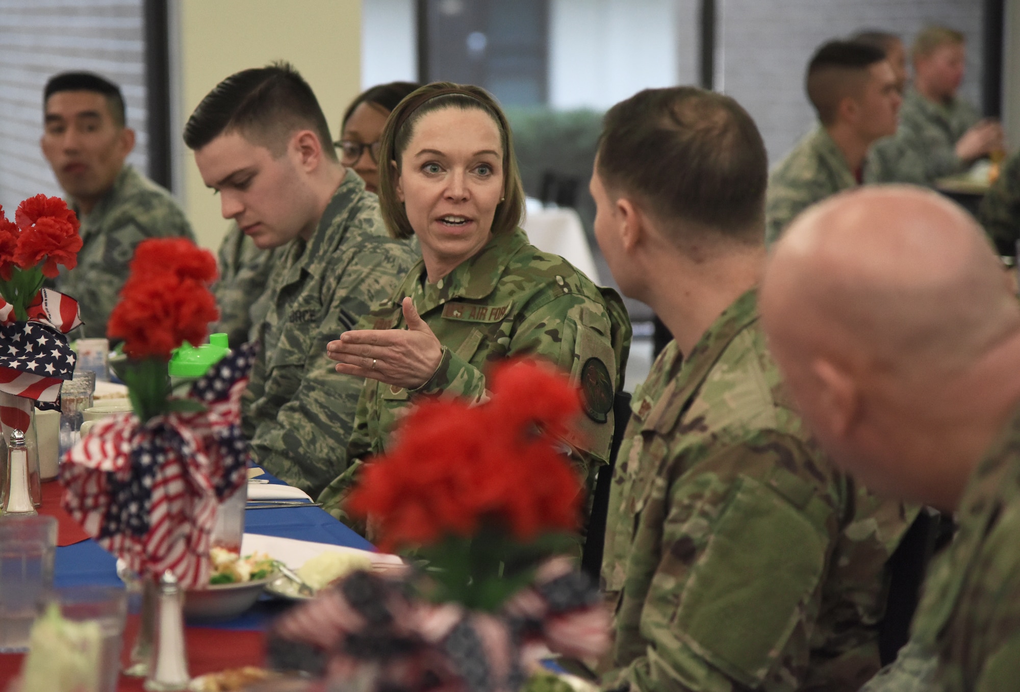 U.S. Air Force Chief Master Sgt. Juliet Gudgel, Air Education and Training Command command chief, speaks with Airmen about their Air Force experience at a lunch inside the Live Oak Dining Facility during a base immersion tour at Keesler Air Force Base, Mississippi, Feb. 15, 2019. Throughout the three-day tour Gudgel received 2nd Air Force and 81st Training Wing mission briefings, ate breakfast with Airmen in training, received an 81st Security Forces Squadron military working dog demonstration and served as the guest speaker at the Chief Master Sergeant Induction Ceremony. (U.S. Air Force photo by Kemberly Groue)