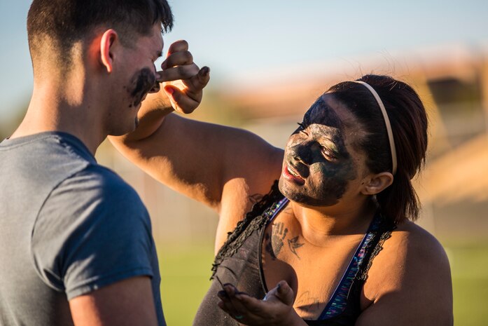 U.S. Marines assigned to Marine Aviation Logistics Squadron (MALS) 13 and their spouses participate in Jane Wayne Day at Marine Corps Air Station (MCAS) Yuma Jan. 25, 2019. Jane Wayne Day consisted of applying camouflage paint, getting some "drill instructor time", conducting a modified combat fitness test (CFT), going through the Obstacle Course, learning a few Marine Corps Martial Arts Program (MCMAP) techniques, and shooting the Beretta M9 Pistol. Jane Wayne Day is designed to give the spouses a little insight on some of the things their Marine does while having fun. (U.S. Marine Corps photo by Cpl. Sabrina Candiaflores)