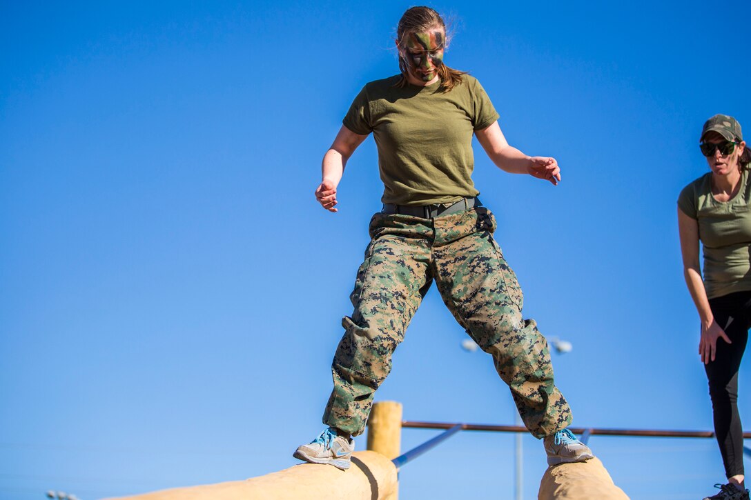 U.S. Marines assigned to Marine Aviation Logistics Squadron (MALS) 13 and their spouses participate in Jane Wayne Day at Marine Corps Air Station (MCAS) Yuma Jan. 25, 2019. Jane Wayne Day consisted of applying camouflage paint, getting some "drill instructor time", conducting a modified combat fitness test (CFT), going through the Obstacle Course, learning a few Marine Corps Martial Arts Program (MCMAP) techniques, and shooting the Beretta M9 Pistol. Jane Wayne Day is designed to give the spouses a little insight on some of the things their Marine does while having fun. (U.S. Marine Corps photo by Cpl. Sabrina Candiaflores)