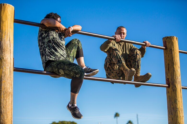 U.S. Marines assigned to Marine Aviation Logistics Squadron (MALS) 13 and their spouses participate in Jane Wayne Day at Marine Corps Air Station (MCAS) Yuma Jan. 25, 2019. Jane Wayne Day consisted of applying camouflage paint, getting some "drill instructor time", conducting a modified combat fitness test (CFT), going through the Obstacle Course, learning a few Marine Corps Martial Arts Program (MCMAP) techniques, and shooting the Beretta M9 Pistol. Jane Wayne Day is designed to give the spouses a little insight on some of the things their Marine does while having fun. (U.S. Marine Corps photo by Cpl. Sabrina Candiaflores)